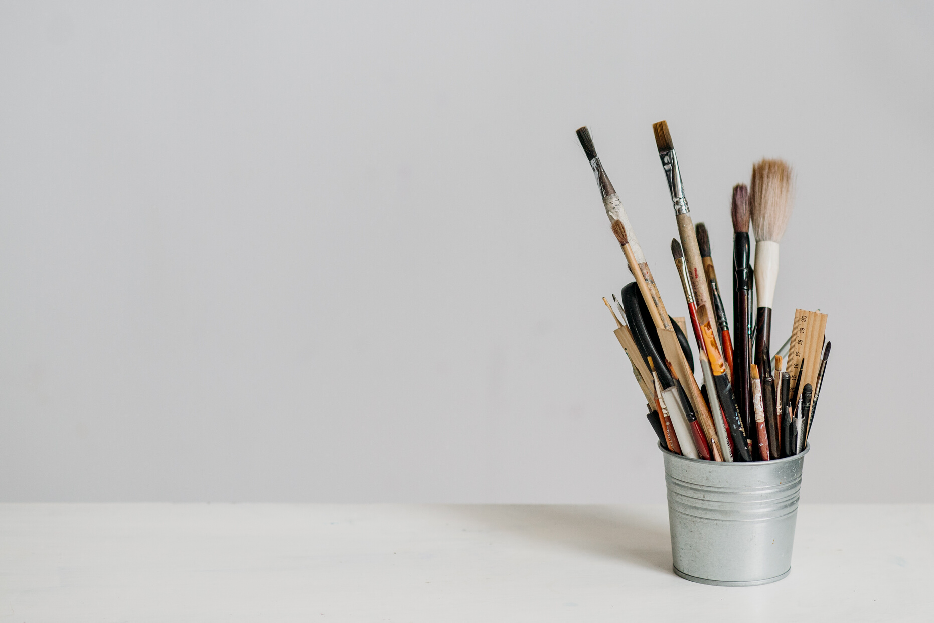 Assorted Paint Brushes in a Small Tin Can